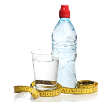 Bottle with water and a measuring tape